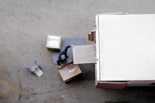 Prepared boxes and furniture ready for a moving truck in Cricklewood