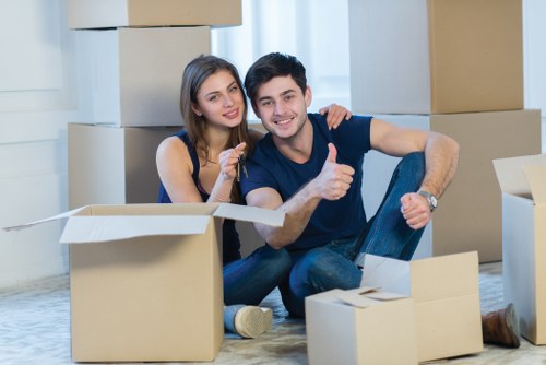Professional movers handling furniture with care in Cricklewood