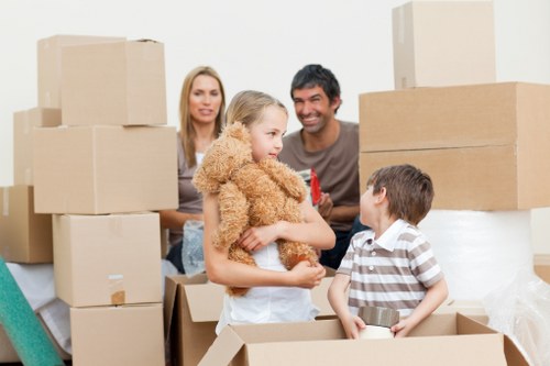 Unpacking boxes in a Cricklewood property after moving day